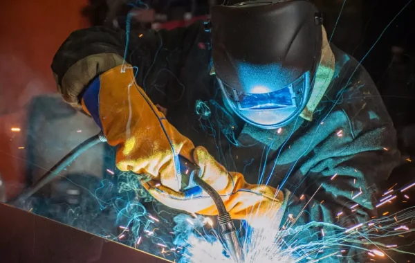 Welder from 3D Welding Services welding a piece of equipment together