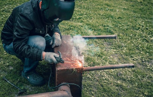 A welder is seen at a work site. 3D Welding Services is the best of the welding companies in Pekin IL.