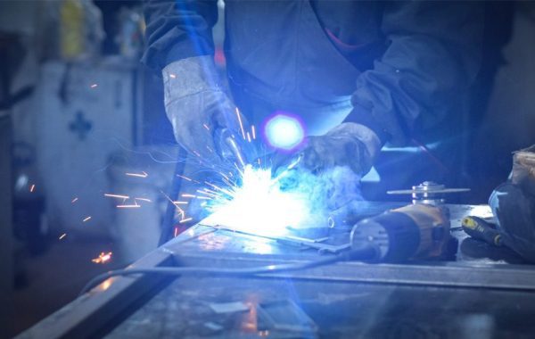 a-worker-welder-in-work-clothes-construction