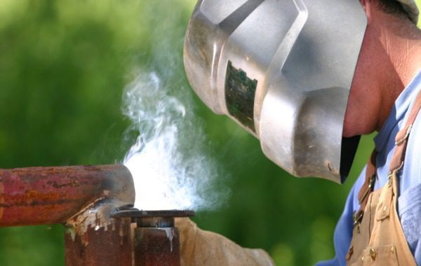 A welder is seen at a job site. 3D Welding Services is the best of the welding services in Peoria IL.