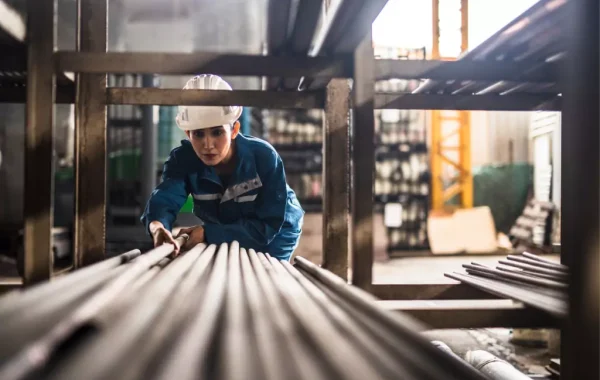 A welder pulling out a metal sheet for using for metal fabrication in Illinois