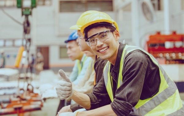 A happy metal fabrication expert giving a thumbs up