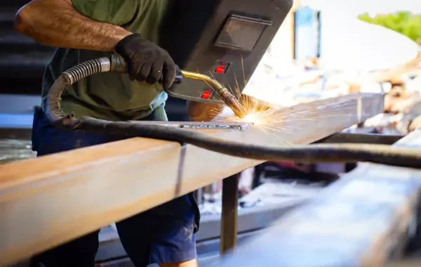 Welder performing metal repair in Central Illinois