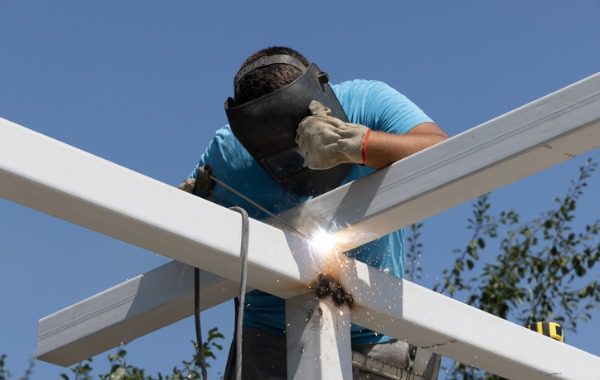 A welder is seen at a job site. 3D Welding Services is the best of the welding companies in Peoria IL.